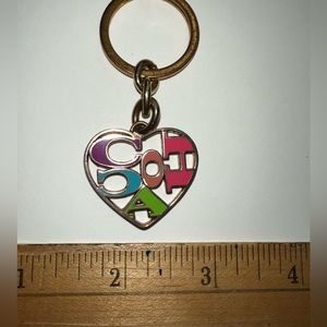 Vintage metal multicolored Coach hangtag